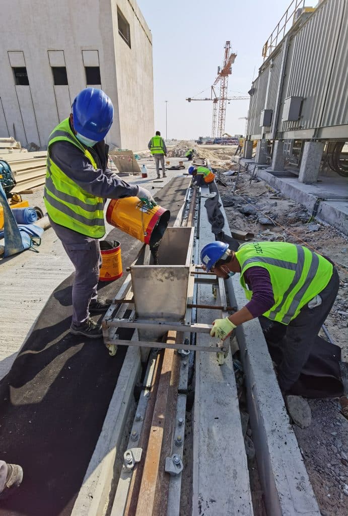 Epoxy grout installation under crane rail sole plate