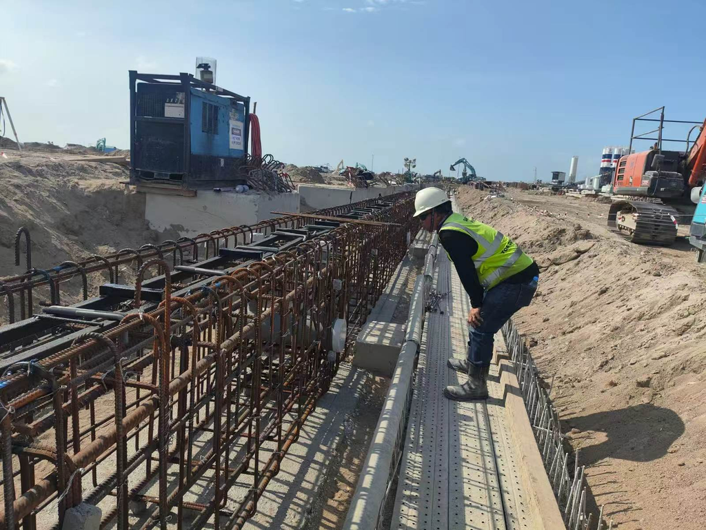 Inspection of crane rail foundation rebar cage, port construction site