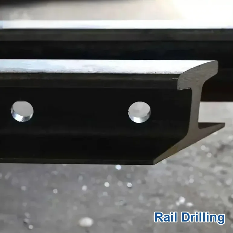 Drilling crane rail web holes for a fishplate joint
