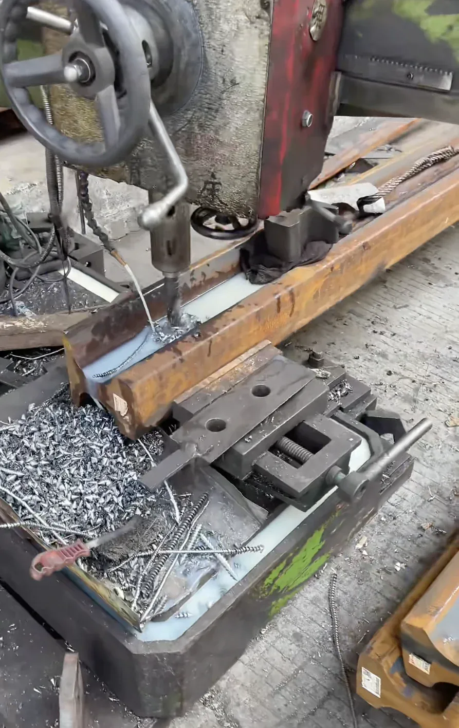 Drilling rail web holes to a fishplate pattern