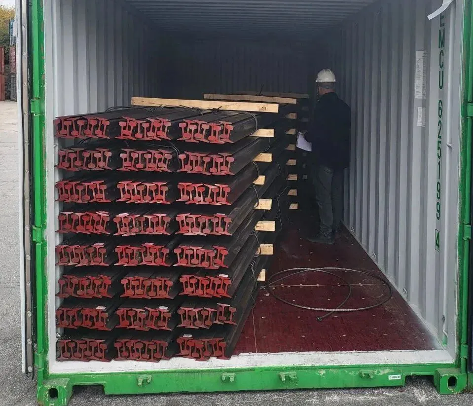 Crane rail bundles loaded inside a container